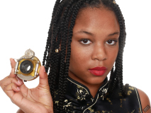 Caleann in tight black-and-gold Cheongsam examines Bausch & Lomb shutter c/w Beck lens assembly