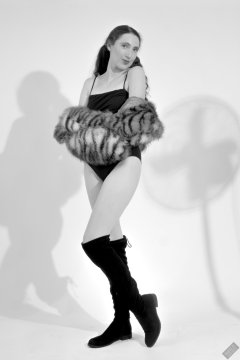 2026-08-01 Estella Rose models black one-piece swimsuit and accessories..