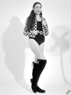2026-08-01 Estella Rose models black one-piece swimsuit and accessories..