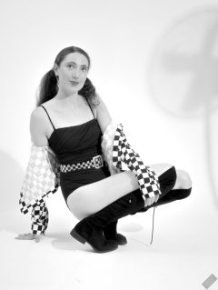 2026-08-01 Estella Rose models black one-piece swimsuit and accessories..