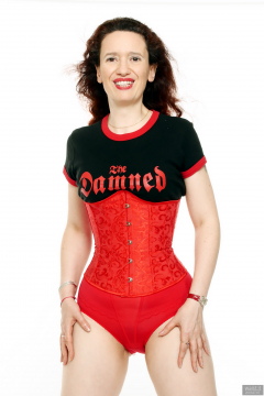 2018-07-07 Chiara in a tightly-laced underbust corset, worn over her own "Damned" t-shirt, worn over red Chinese bra and pocket girdle