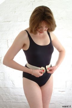 Debbie in black one-piece swimsuit