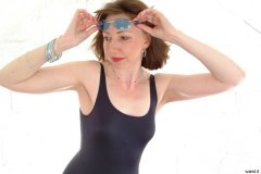 Debbie in black one-piece swimsuit