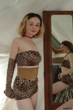 Annie models retro animal print bikini and suede corset belt