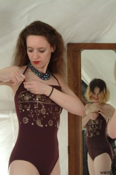 Chiara in maroon one-piece swimsuit