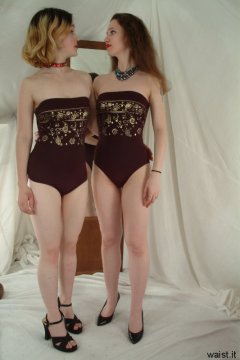 Annie and Chiara modelling maroon one-piece swimsuits