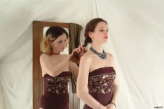 Annie and Chiara modelling maroon one-piece swimsuits