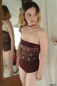 Annie in maroon one-piece swimsuit