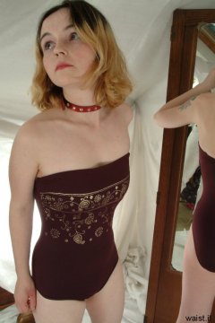 Annie in maroon one-piece swimsuit