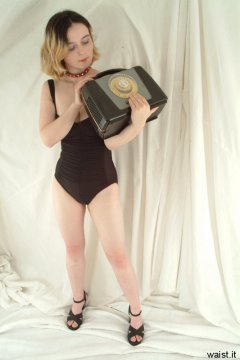 Annie poses in tight retro Caro Wior figure-control swimsuit