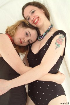 Annie and Chiara modelling black one-piece swimsuits