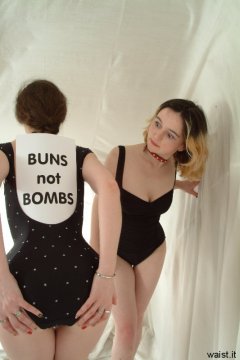 Chiara and Annie modelling black one-piece swimsuits