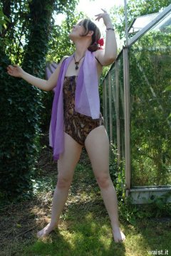 Annie in animal print one-piece swimsuit