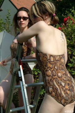Chiara and Annie in animal print one-piece swimsuits