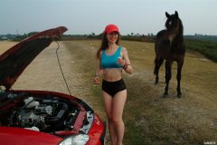 Chiara in blue top and black Dim-Up pantie girdle worn a hot pants