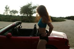 Chiara in blue top and black Dim-Up pantie girdle worn a hot pants