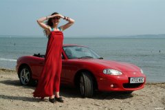 Chiara at Tanners Lane Beach with red Mazda MX5