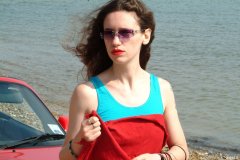 Chiara at Tanners Lane Beach with red Mazda MX5