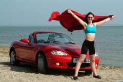 Chiara at Tanners Lane Beach with red Mazda MX5