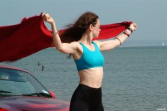 Chiara at Tanners Lane Beach with red Mazda MX5