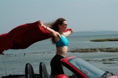 Chiara at Tanners Lane Beach with red Mazda MX5