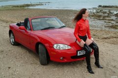 Chiara at Tanners Lane Beach with red Mazda MX5