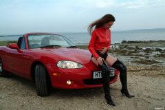 Chiara at Tanners Lane Beach with red Mazda MX5