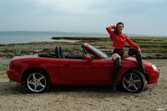 Chiara at Tanners Lane Beach with red Mazda MX5