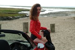 Chiara at Tanners Lane Beach with red Mazda MX5