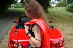 Chiara wears her Dim Up's as hot pants, in the New Forest, with red Mazda MX5