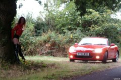 Chiara wears her Dim Up's as hot pants, in the New Forest, with red Mazda MX5