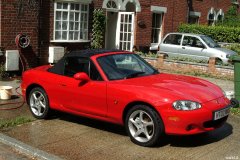 Chiara 'bikini carwashes' a red MX5