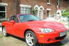 Chiara 'bikini carwashes' a red MX5