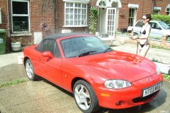 Chiara 'bikini carwashes' a red MX5