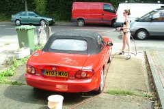 Chiara 'bikini carwashes' a red MX5