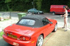 Chiara 'bikini carwashes' a red MX5