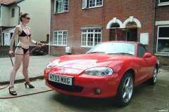 Chiara 'bikini carwashes' a red MX5