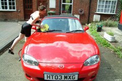 Chiara 'bikini carwashes' a red MX5