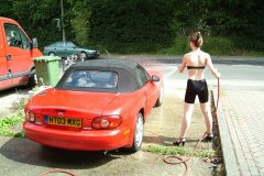 Chiara 'bikini carwashes' a red MX5