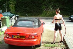 Chiara 'bikini carwashes' a red MX5
