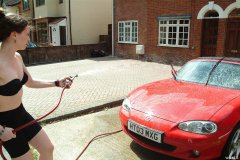 Chiara 'bikini carwashes' a red MX5