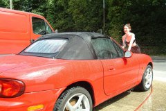 Chiara 'bikini carwashes' a red MX5