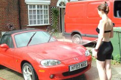 Chiara 'bikini carwashes' a red MX5