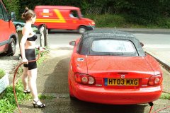 Chiara 'bikini carwashes' a red MX5