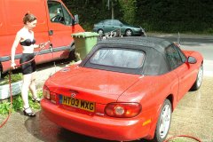 Chiara 'bikini carwashes' a red MX5