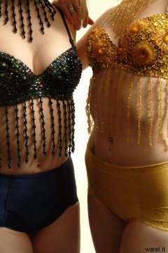 Chiara and Carlie body shot, showing off flat tummies, whilst modelling matching dance tops and control pants