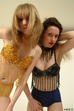 Chiara and Carlie posing in matching dance tops and control pants