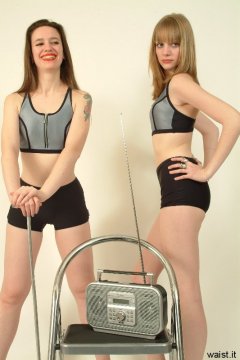 Chiara and Carlie pose in matching sportswear tops and hot pants