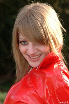 Carlie models red PVC jacket