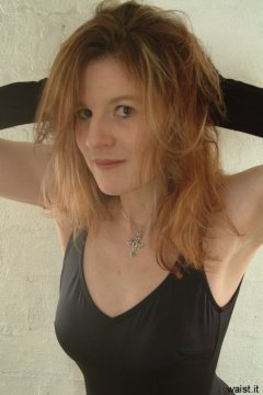 Juleigh in black tummy-control one-piece swimsuit